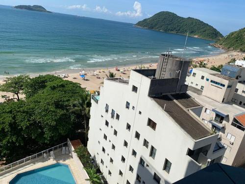 Tombo Apartment | Apto Pé na Areia melhor praia do Guarujá, Tombo 2 dormitórios com suíte