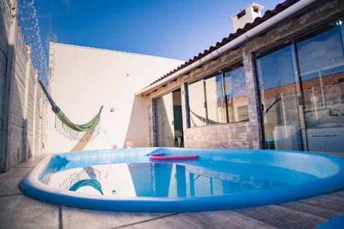 Sao Goncalo House | Casa 3 min Shopping Pelotas- Com 1 Suíte, 2 Quartos Climatizados, Piscina e Estacionamento 2 carros