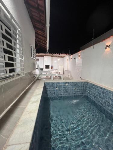 Cibratel II House | Casa Aconchegante em Itanhaem- Piscina e Churrasqueira 10 pessoas