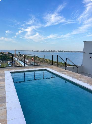 Encarnacion Apartment | Edificio Paraná Playa Costanera, Apartamento de 1 Habitación, vista frontal al Rio con parking y Amenities!