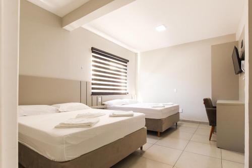 Guarapuava Apartment | Lou Suítes 3- 2 camas de casal - Conforto para sua Família