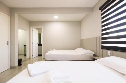 Guarapuava Apartment | Lou Suítes 9- com 2 camas de casal - total confort