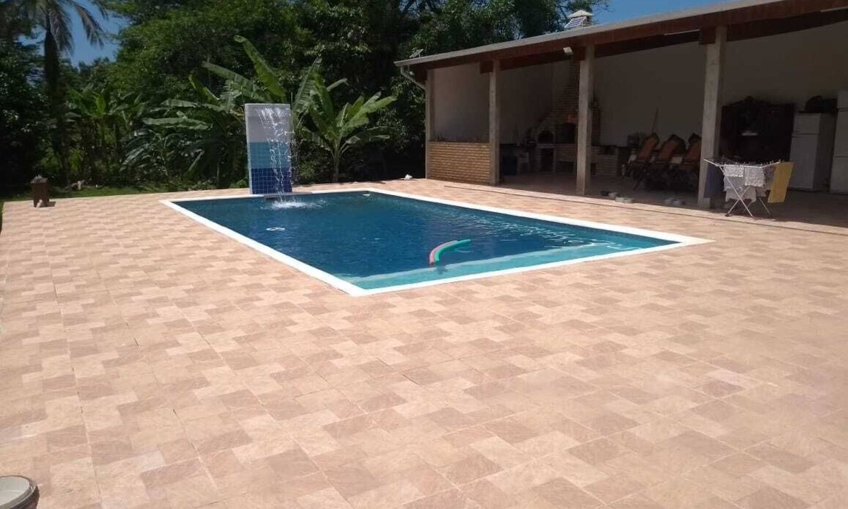 Peruibe House | Property with a pool, barbecue, and plenty of greenery, near the beach.