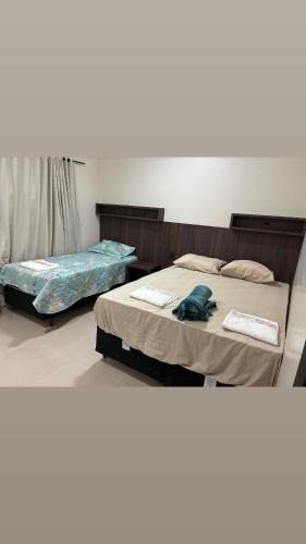 Lixeira House | Quarto com TV 50 polegadas, frigobar, ar-condicionado e Wi Fi, sala e cozinha compartilhado