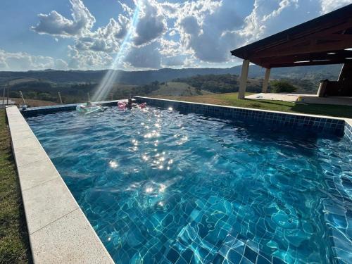Extrema House | Refúgio em Extrema com piscina climatizada