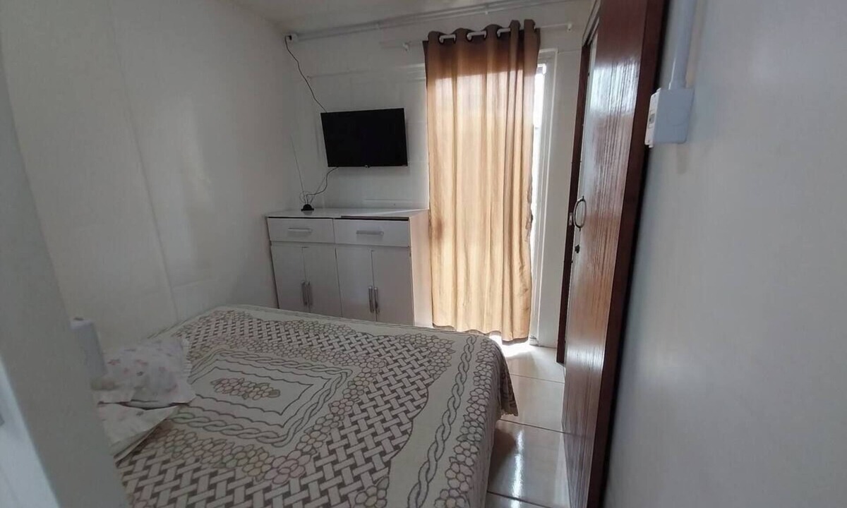 Cidade Nova Apartment | Suite with morning sun + air conditioning