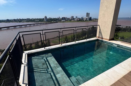 Encarnacion Apartment | Alfina Inn, space created for your comfort, river view, privileged terrace.