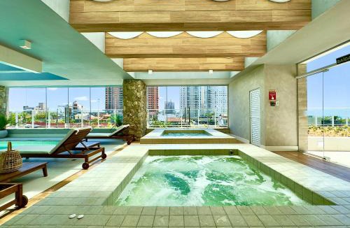 Itacolomi Apartment | Apartamento em Condomínio Frente-Mar com Piscinas, Jacuzzi Aquecida, Sauna, Academia, Brinquedoteca, Churrasqueira na Sacada, Cozinha Completa e Lazer de Home Club