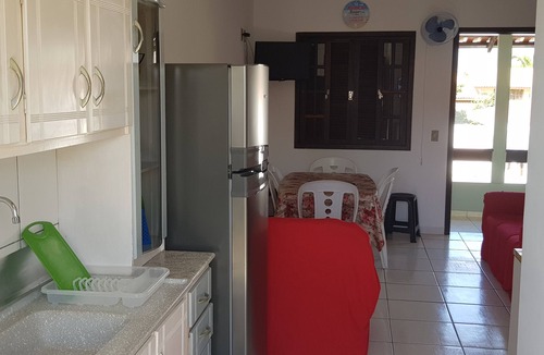 Itapoa Apartment | Apartment in a gated community with a swimming pool.