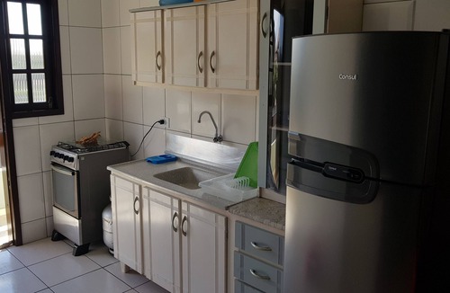 Itapoa Apartment | Apartment in a gated community with a swimming pool.