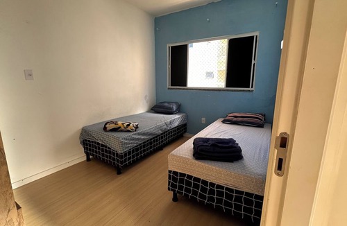 Santa Maria Apartment | Apartment near the airport with a combined balcony, air conditioning, and a hammock.