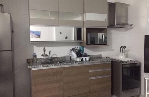 Parque Enseada Apartment | Apartment with gourmet balcony, ocean view and spa.