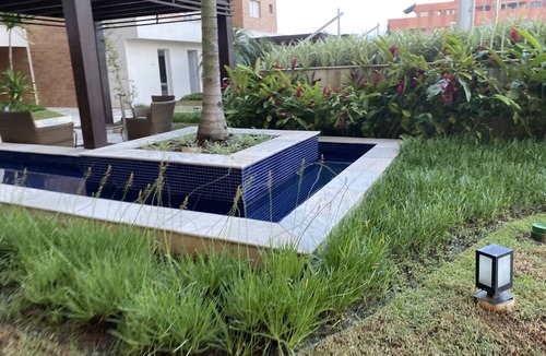Parque Enseada Apartment | Apartment with gourmet balcony, ocean view and spa.
