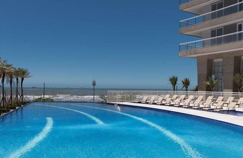 Pompeia Apartment | Beachfront studio with infinity pool and sea view