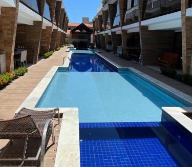 Poco Villa | Casa em condomínio na praia