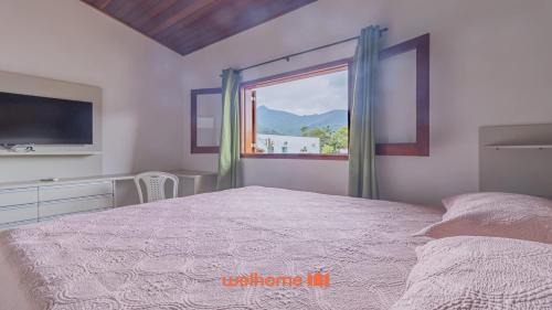 Horto House | Casa em Ubatuba com churrasqueira e varanda ampla