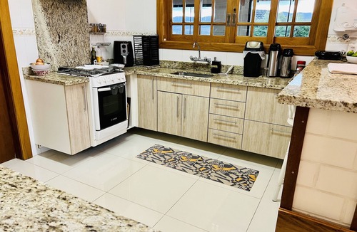 Campos do Jordao Cottage | Condominium with a heated pool, playground, hydrotherapy area, jacuzzi, and a beautiful view.