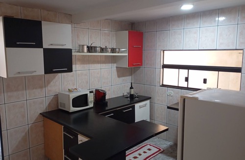 Fazenda Rio Grande Apartment | Cozy house with a private space on the lower level of the two-story house with a kitchen.