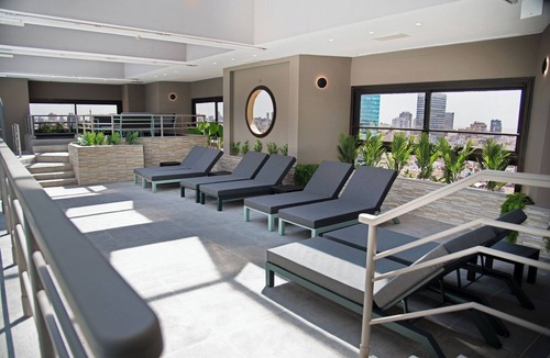 Microcentro Hotel | Escape to a Tranquil Room Near Puerto Madero Riverfront Dining | Rooftop Pool