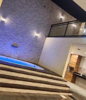 Trindade House | Espaço Frente ao Lago