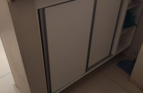 Nazare Apartment | Large bedroom and living room, laundry area, washing machine. He doesn't even know how to climb stairs