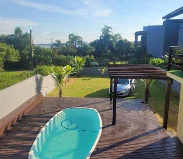 Ibiraquera House | LINDA CASA COM PISCINA DE FRENTE PARA A LAGOA