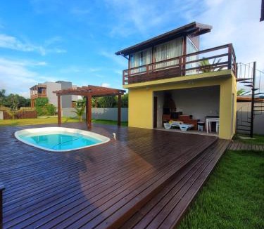 Ibiraquera House | LINDA CASA COM PISCINA DE FRENTE PARA A LAGOA