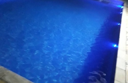 Igarata House | Property with swimming pool, soccer field, Wi-Fi, and a lake with many fish.