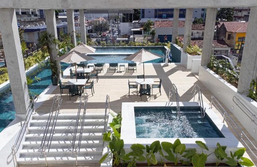 Madalena Apartment | Tolive Riverside - High-end studios in Recife with rooftop pool, gym, coworking space, laundry, snack bar, playground, and pet area by Carpediem