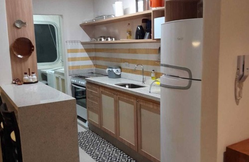 Jardim Vitoria Apartment | Two blocks from the beautiful Enseada Beach in Guarujá.