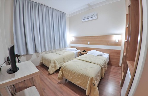 Centro Hotel | Walk to Bella Citta Shopping From This Downtown Solo Retreat