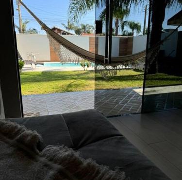 Casa aconchegante com piscina na praia in Imbituba