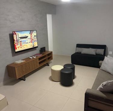 Casa em Praia Grande com Wi-Fi a 50m do mar com 2 suítes e 2 vagas de garagem