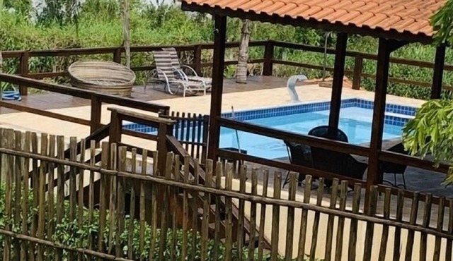 Country house with fireplace and swimming pool.