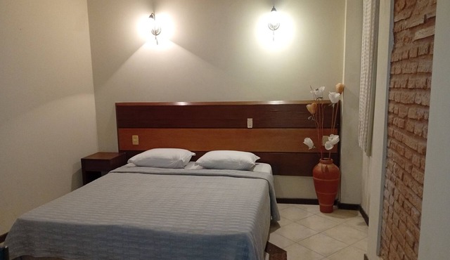 Direita S.Antonio Agreste Suite with bathroom, air conditioning and king-size bed.