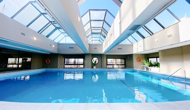 Escape to a Tranquil Room Near Puerto Madero Riverfront Dining | Rooftop Pool