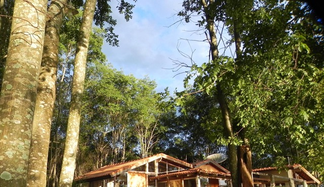 House in the woods, surrounded by the Rio Grande and stunning view of the sunset. in Delfinopolis