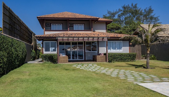 House with pool and beachfront access.