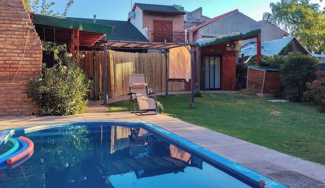 Nancy and Carlos's house, view of the mountains, swimming pool and barbecue area.