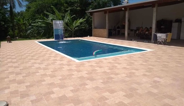 Property with a pool, barbecue, and plenty of greenery, near the beach. in SP