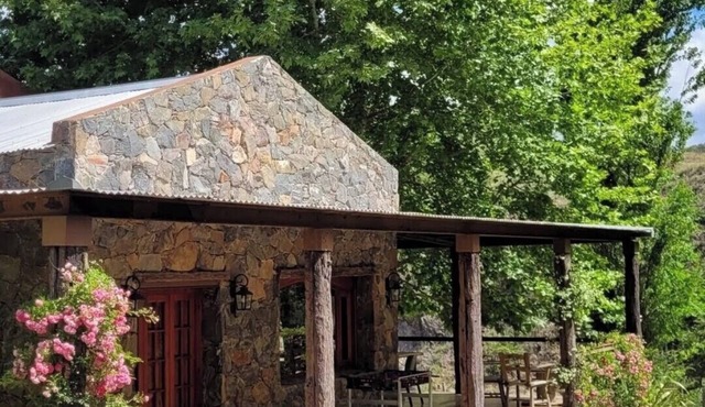 Stone house next to the El Durazno River on private property