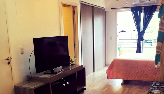 Studio apartment with garage and balcony overlooking the city