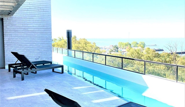 Stylish apartment by river with pool & grill