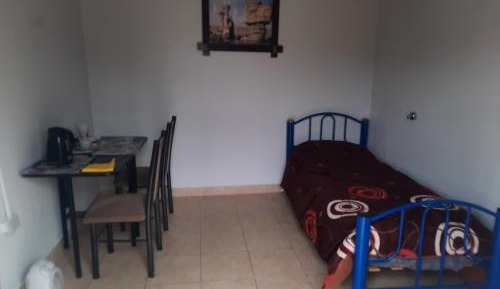 Single Bed in Dormitory Room