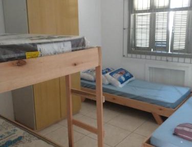 Single Bed in Dormitory Room