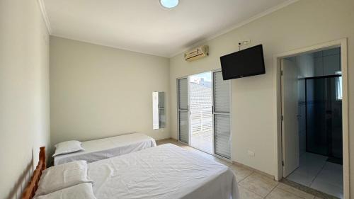 Balneario Florida House | Casa 300m Praia, Ar condicionado, Área Gourmet, Piscina climatizada