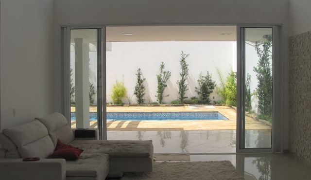 Contemporary style house with 4 suites and 6 bathrooms in gated community